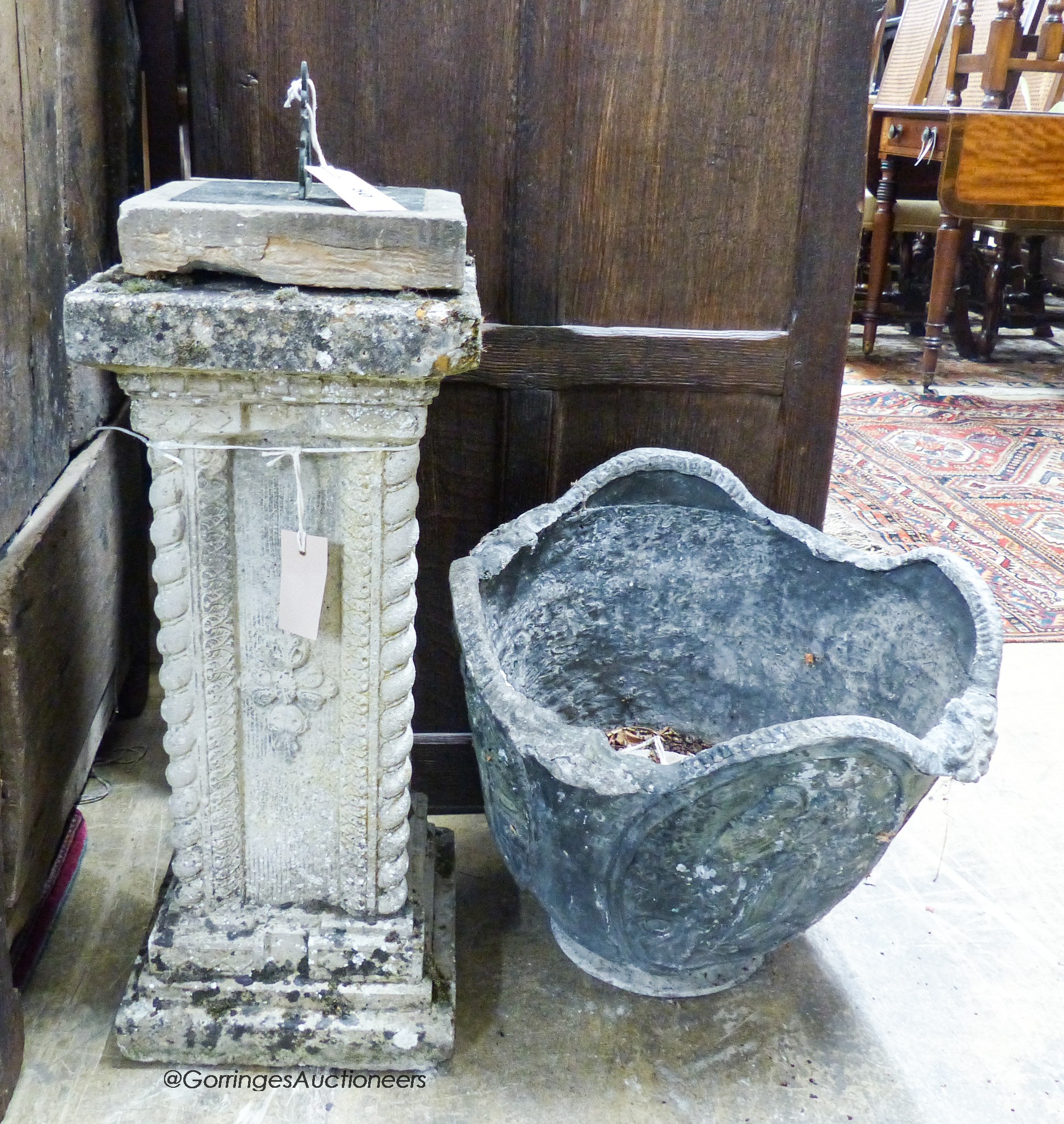 A copper sundial on reconstituted stone plinth, height 73cm together with a circular cast lead planter, diameter 43cm